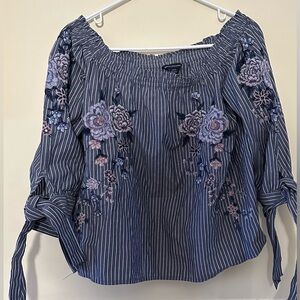 AMERICAN EAGLE OUTFITTERS size S off shoulder blue pinstripe with flower top.